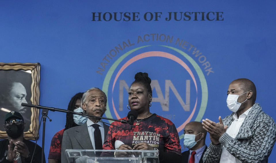 Rev. Al Sharpton, third from left, president of the National Action Network (NAN), and Mayor Eric Adams, far right, stand next to Sybrina Fulton, center, the mother of Trayvon Martin, as she address a rally commemorating the 10th anniversary of her son's killing, Saturday Feb. 26, 2022, at NAN's Harlem headquarters in New York. "Today is a bittersweet day," said Fulton, who with her family created the Trayvon Martin Foundation to raise awareness of gun violence. (AP Photo/Bebeto Matthews)