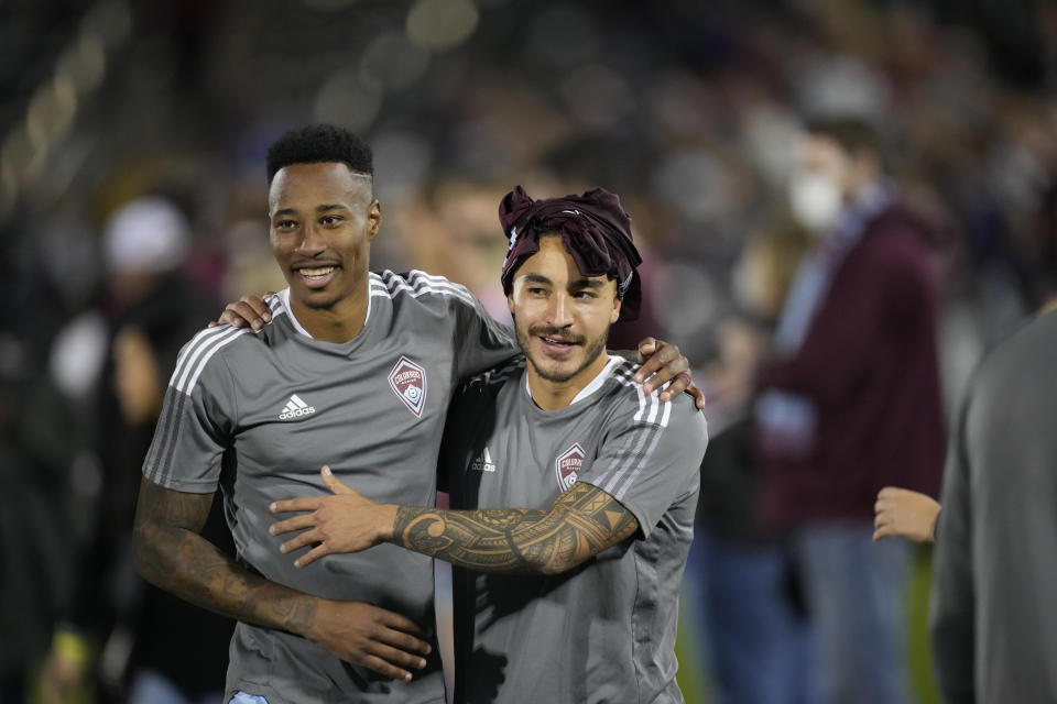 Colorado Rapids forward Andre Shinyashiki, right, and midfielder Mark-Anthony Kaye celebrate after the second half of an MLS soccer match against Los Angeles FC Sunday, Nov. 7, 2021, in Commerce City, Colo. The Rapids won 5-2. (AP Photo/David Zalubowski)