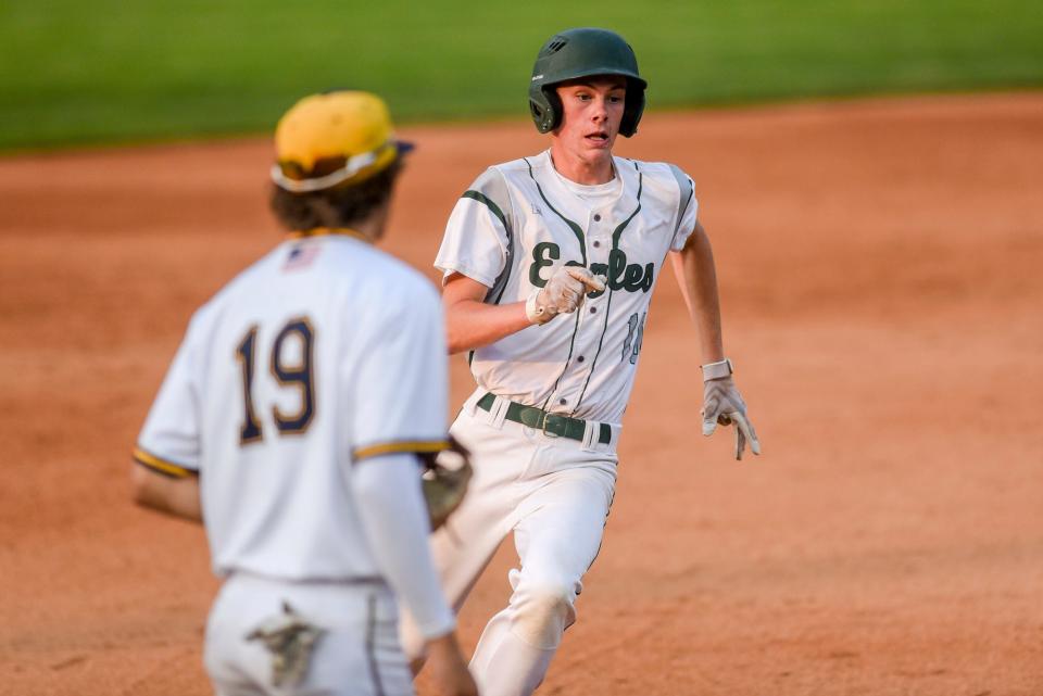 Olivet's Bryce Wine rounds third base on his way to scoring against Grand Ledge in the third inning on Monday, June 5, 2023, at McLane Stadium on the Michigan State University campus in East Lansing.