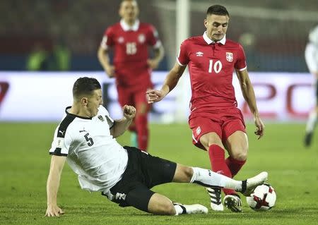 Football Soccer - Serbia v Austria - 2018 World Cup Qualifying European Zone - Group D - Belgrade stadium, Belgrade, Serbia - 9/10/16 Serbia's Dusan Tadic and Austria's Kevin Wimmer in action REUTERS/Marko Djurica