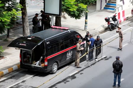 Police Explosive Ordnance Disposal (EOD) officers work following a small explosion at a site in Bangkok