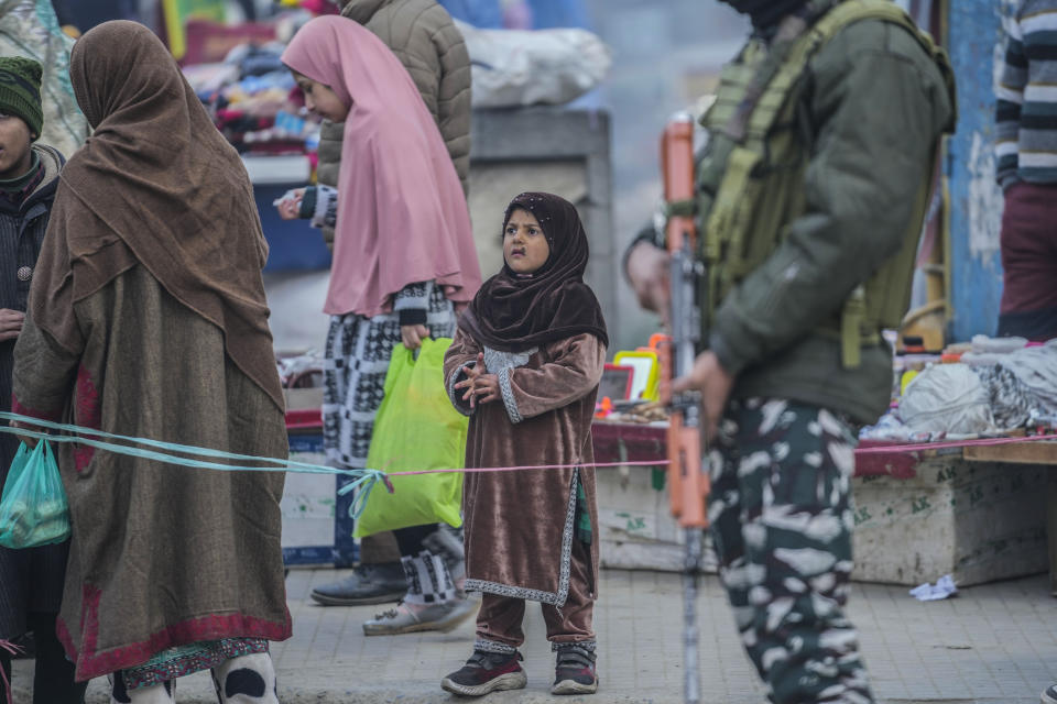 An Indian paramilitary soldier stands guard in Srinagar, Indian controlled Kashmir,Tuesday, Dec 23, 2023. Anger spread in some remote parts of Indian-controlled Kashmir after three civilians were killed while in army custody, officials and residents said Saturday. This comes two days after a militant ambush killed four soldiers. (AP Photo/Mukhtar Khan)