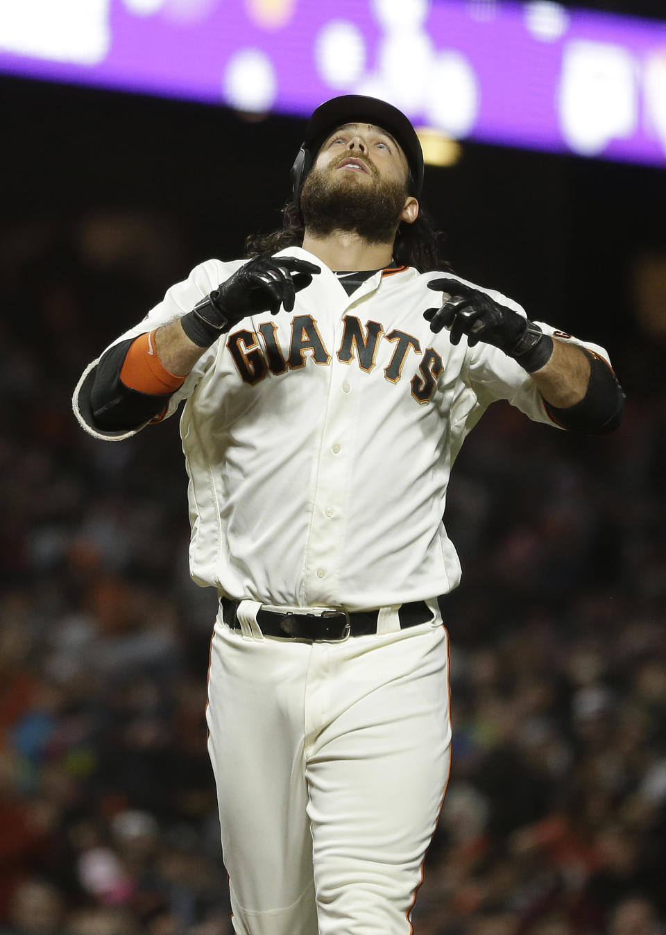 San Francisco Giants' Brandon Crawford looks upward before crossing home plate after hitting a home run off Houston Astros starting pitcher Charlie Morton in the sixth inning of a baseball game Monday, Aug. 6, 2018, in San Francisco. (AP Photo/Eric Risberg)