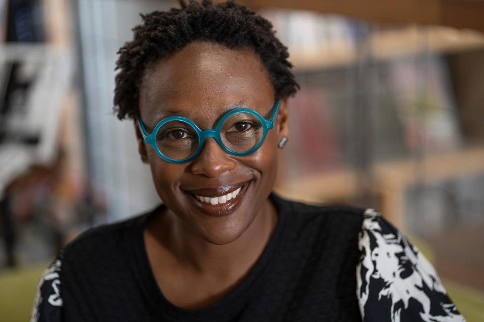 Nandi Comer poses at 27th Letter Books in Detroit on Friday, April 14, 2023. Comer was named Michigan's first poet laureate since the 1950s.