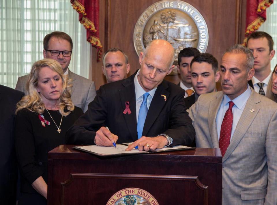 Flanked by Parkland parents and students, Florida Gov. Rick Scott signed a gun-safety measure championed by students from Marjory Stoneman Douglas High in March. The act requires a safe-school officer in every school and provided $67 million to school districts to use that money to train and arm school personnel who weren’t classroom teachers. In May, Florida Gov. Ron DeSantis signed a bill into law, passed by the Florida Legislature, that will allow Florida public schools to arm teachers.