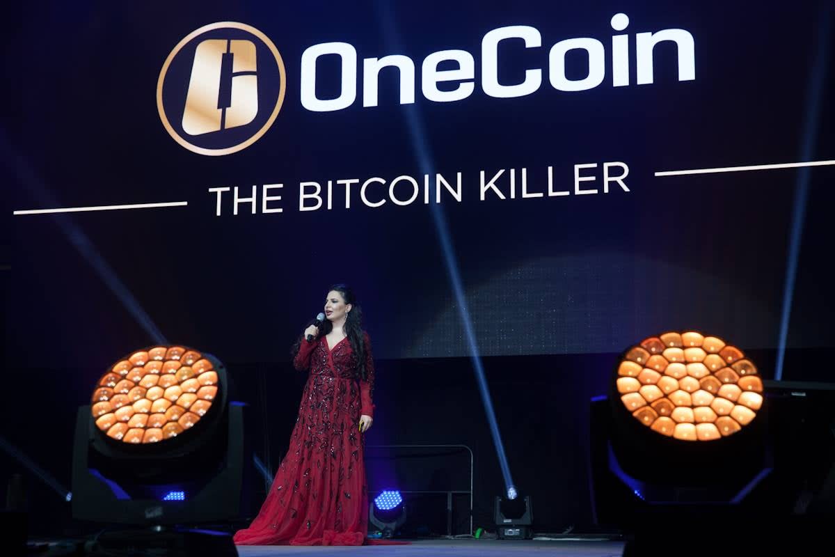 Ruja Ignatova onstage at a OneCoin conference (Facebook/Cryptoqueen)