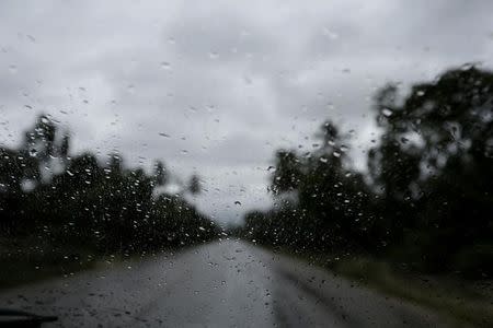 Rain is seen on the front window of a moving car in the outskirts of Les Cayes, Haiti, October 3, 2016. REUTERS/Andres Martinez Casares