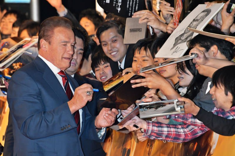 Arnold Schwarzenegger signs autograph during the Japan premiere for the film "Terminator: Dark Fate" in Tokyo in 2019. File Photo by MORI Keizo/UPI