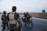 Syrian government troops man a checkpoint town of Tal Tamr in northeast Syria, Monday, Oct. 14, 2019. Syrian government troops moved into towns and villages in northern Syria on Monday, setting up a potential clash with Turkish-led forces advancing in the area as long-standing alliances in the region begin to shift or crumble following the pullback of U.S. forces. (AP Photo/Baderkhan Ahmad)