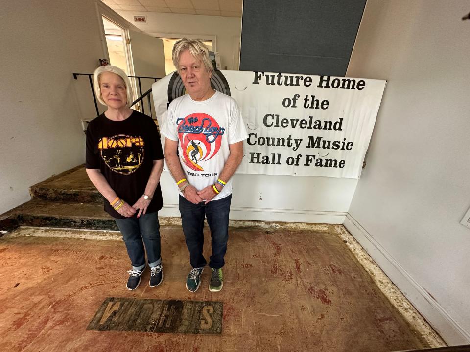 Phil and Patti Weathers stand in the entry of the former WOHS radio station. The building is undergoing renovations and is the future home of the Cleveland County Music Hall of Fame.