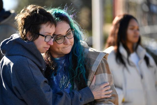Jessy Smith Cruz embraces Jadzia Dax McClendon the morning after a mass shooting at Club Q, an LGBTQ nightclub in Colorado Springs, Colorado, on November 20, 2022.
