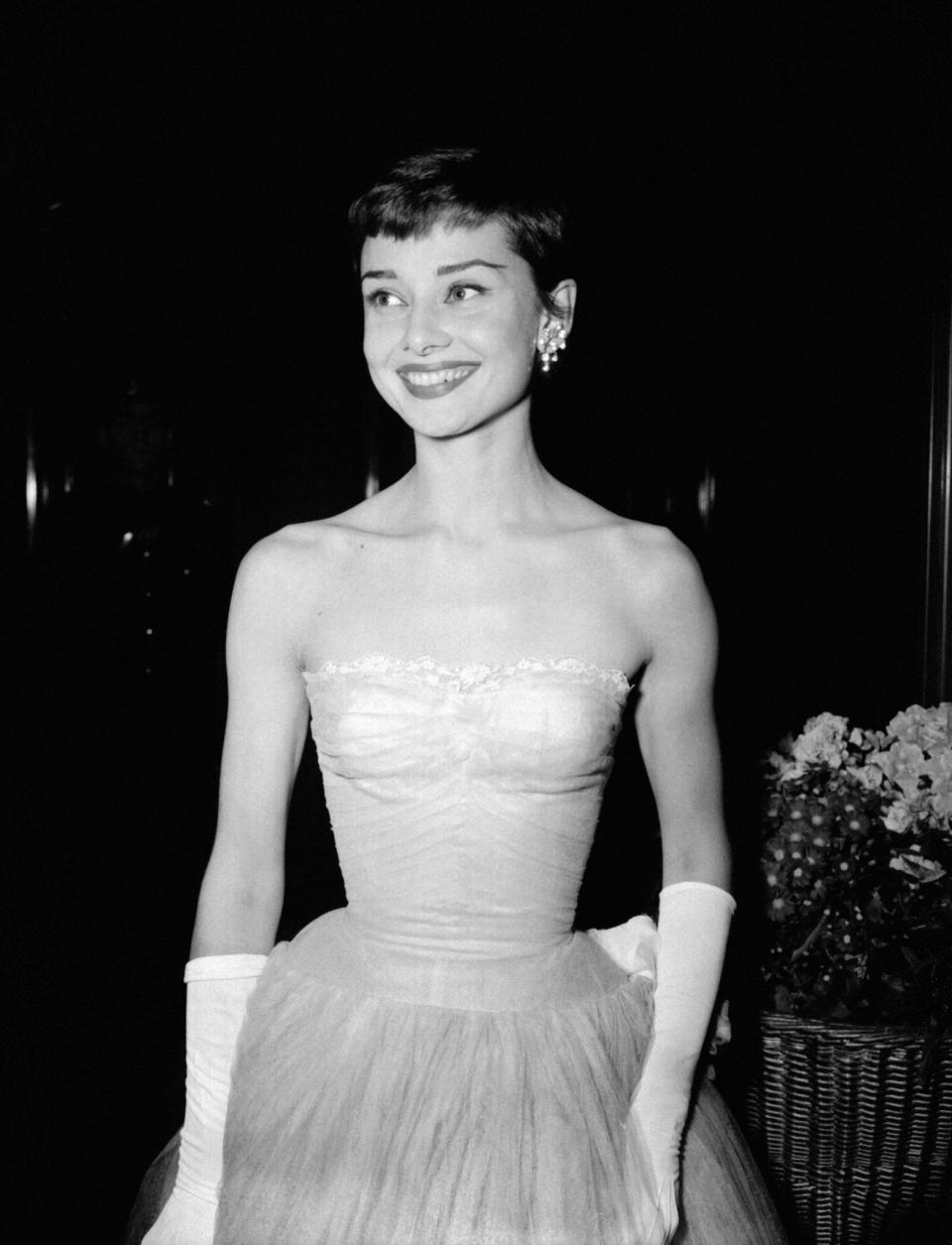 <p>How could we miss Audrey’s glorious pixie cut? A stark contrast to Marilyn Monroe’s volumous curls, the petite film star’s short locks were hugely popular in the 50s. <em>[Photo: PA] </em> </p>