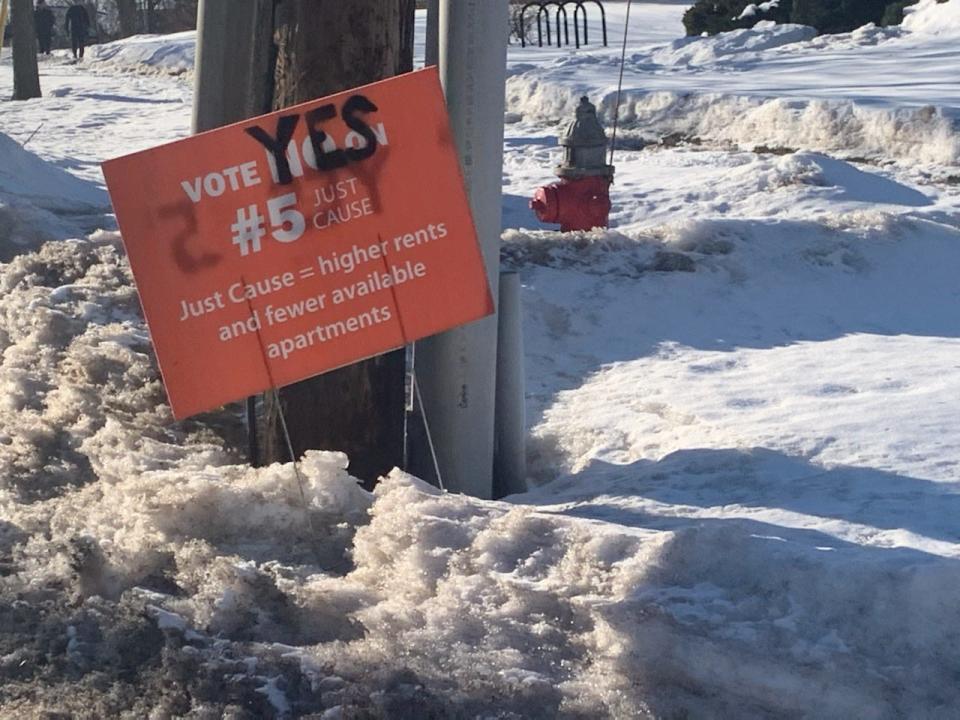 A sign in Burlington encouraging voters to say no to a ballot item regarding "just cause" evictions got marked up to read "yes." Feb. 25, 2021.