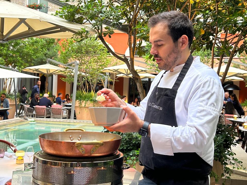 Chef Oliver Piras cooking at the author's table at Il Carpaccio restaurant in Paris.