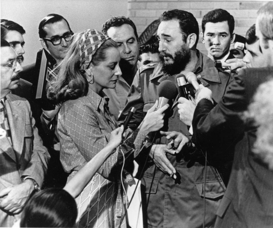 FILE - Cuban Prime Minister Fidel Castro, center right, responds to a question from American NBC reporter Barbara Walters, center left, during a news conference granted to members of the U.S. press covering Senator George McGovern's trip to Cuba, in Havana, May 7, 1975. Walters, a superstar and pioneer in TV news, has died, according to ABC News on Friday, Dec. 30, 2022. She was 93. (AP Photo, File)