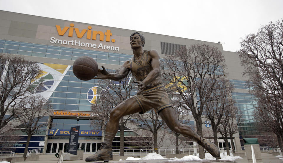 FILE - A statue of Utah Jazz great John Stockton is shown outside of the Vivint Smart Home Arena in Salt Lake City, Jan. 23, 2017. The 19-foot, 4,000-pound statue of Kobe Bryant in downtown Los Angeles is just the latest example of a sports team honoring a player with this kind of larger-than-life presence. (AP Photo/Rick Bowmer, File)