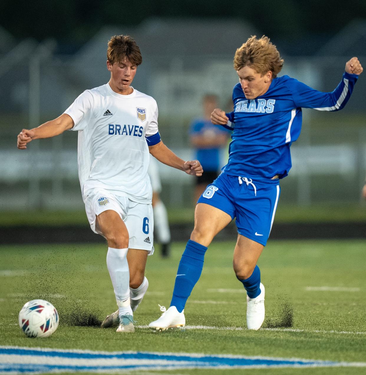 Olentangy's Noah Schmidt (6) attempts to get around Olentangy Berlin's Aydan Alonso.