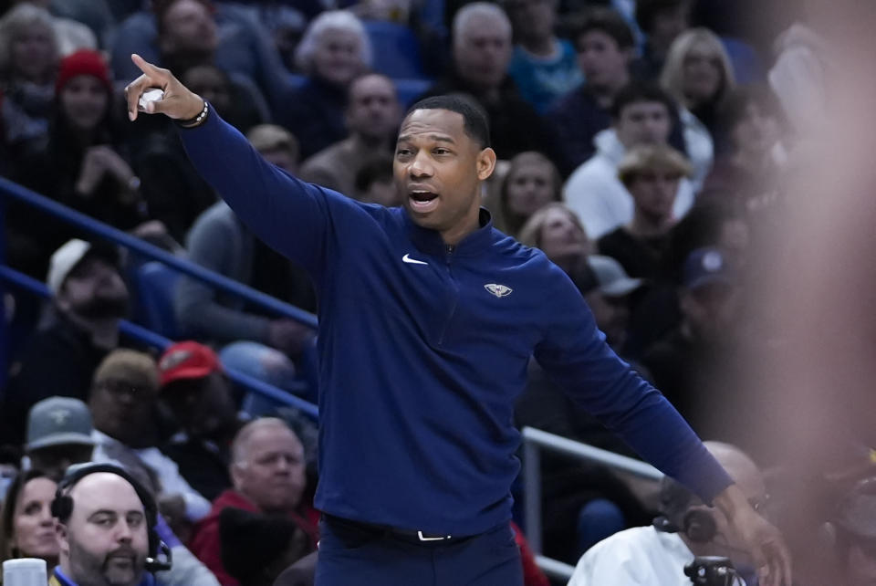 New Orleans Pelicans head coach Willie Green calls out from the bench in the first half of an NBA basketball game against the Charlotte Hornets in New Orleans, Wednesday, Jan. 17, 2024. (AP Photo/Gerald Herbert)