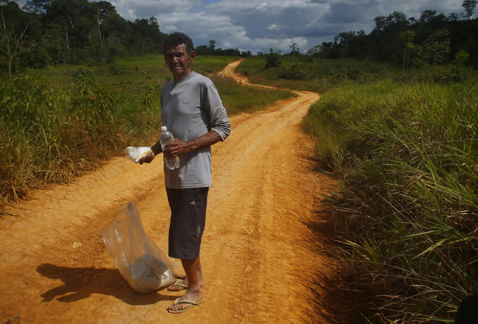 Miner Joao Batista Costa, 61, walks for days to leave the Yanomami Indigenous territory ahead of expected operations against illegal mining in Alto Alegre, Roraima state, Brazil, Tuesday, Feb. 7, 2023. The government declared a public health emergency for the Yanomami people in the Amazon, who are suffering from malnutrition and diseases such as malaria as a consequence of illegal mining. Costa, told reporters the Yanomami are dying of hunger and that the recent emergency shipment of food has not been enough. (AP Photo/Edmar Barros)