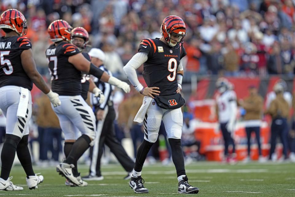 Cincinnati Bengals quarterback Joe Burrow (9) looks down after being sacked during the second half of an NFL football game against the Houston Texans Sunday, Nov. 12, 2023, in Cincinnati. (AP Photo/Carolyn Kaster)