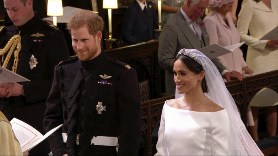 Prince Harry and Meghan Markle stand during their wedding ceremony at St. George’s Chapel in Windsor Castle on Saturday. (Image: UK Pool/Sky News via AP)