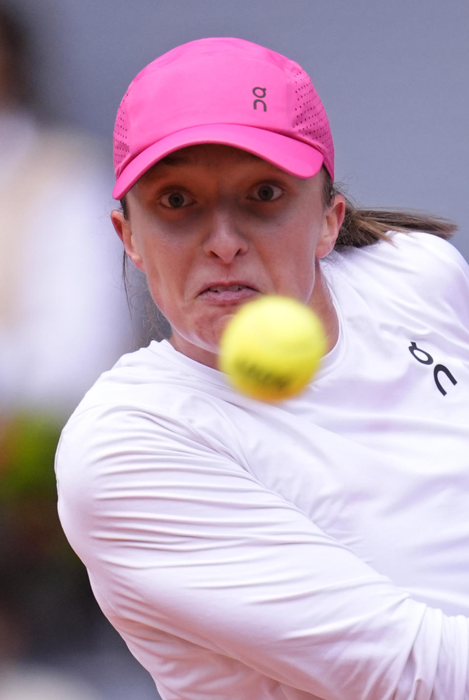 Iga Swiatek of Poland eyes the ball before returning it to Madison Keys of USA during the Mutua Madrid Open tennis tournament in Madrid, Spain, Thursday, May 2, 2024. (AP Photo/Manu Fernandez)