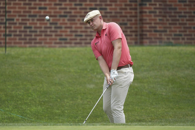 Harry Hall chips onto the 16th green during the first round of the Charles Schwab Challenge golf tournament at the Colonial Country Club in Fort Worth, Texas, Thursday, May 25, 2023. (AP Photo/LM Otero)