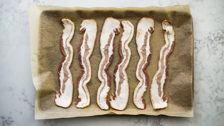 bacon on parchment paper lined tray