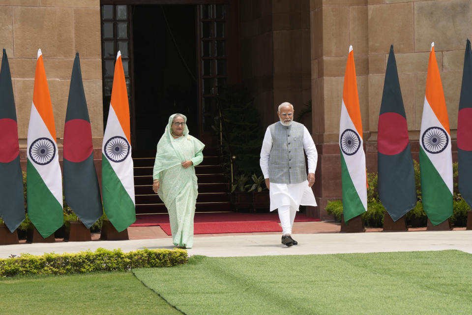 Indian Prime Minister Narendra Modi, right, with his Bangladeshi counterpart Sheikh Hasina walk for a photo call for media before their delegation level meeting, in New Delhi, India, Saturday, June 22, 2024. Hasina is on a two day state visit to India.(AP Photo/Manish Swarup)