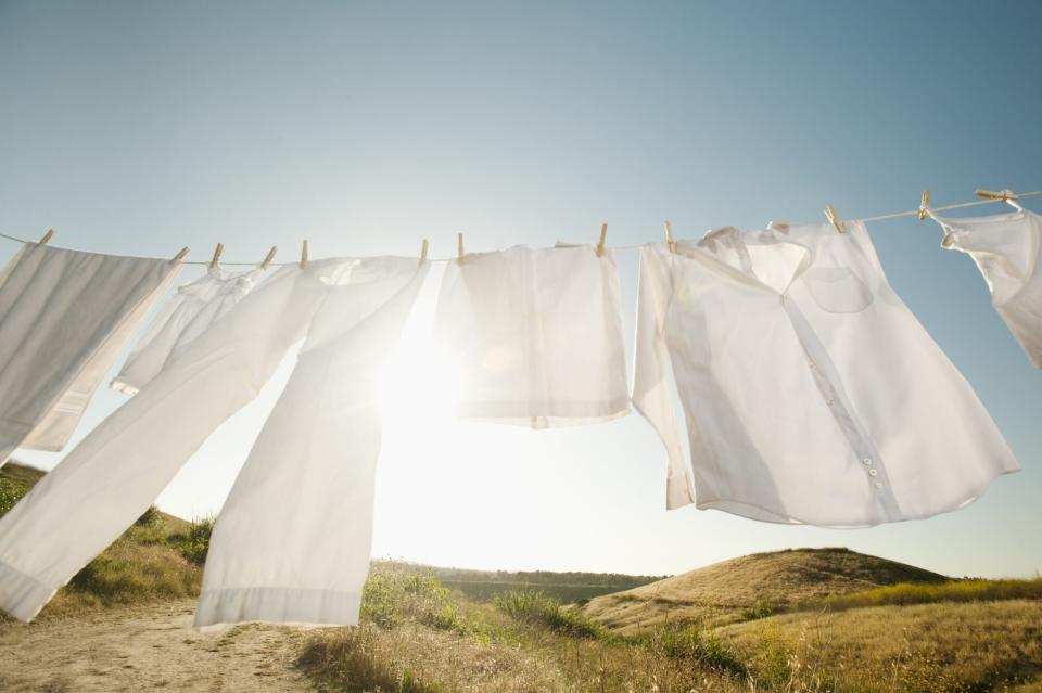 white clothes drying outdoors on clothesline