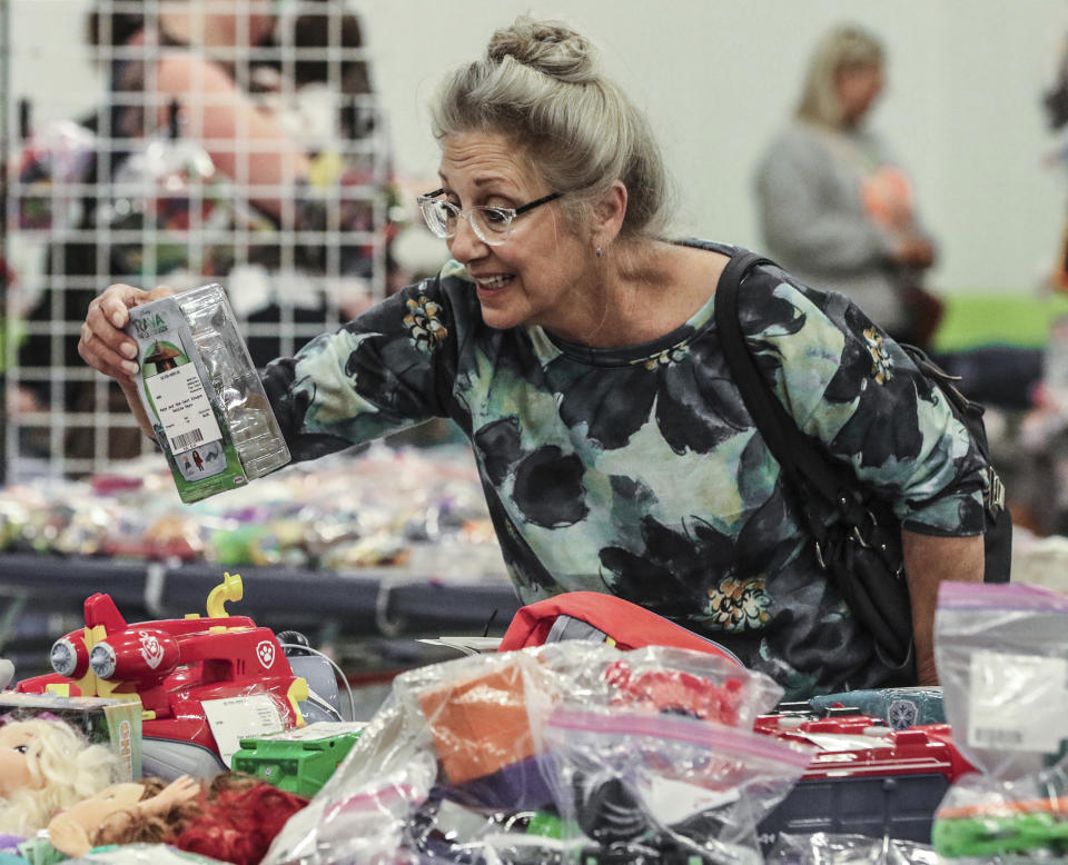 FILE - Cathy Payne of Henderson looks at toys for her granddaughter at the Pigtails & Cowlicks consignment sale on Apr. 20, 2024, in Owensboro, Ky. On Tuesday, June 25, 2024, the Conference Board issues its monthly survey of consumer confidence in the United States, which reflects Americans' assessment of current economic conditions and their outlook for the next six months. (Greg Eans/The Messenger-Inquirer via AP, File)