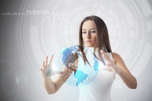 Woman moving an augmented reality world with her hands.
