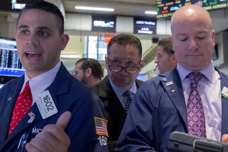 Traders work on the floor of the New York Stock Exchange July 6, 2015. REUTERS/Brendan McDermid