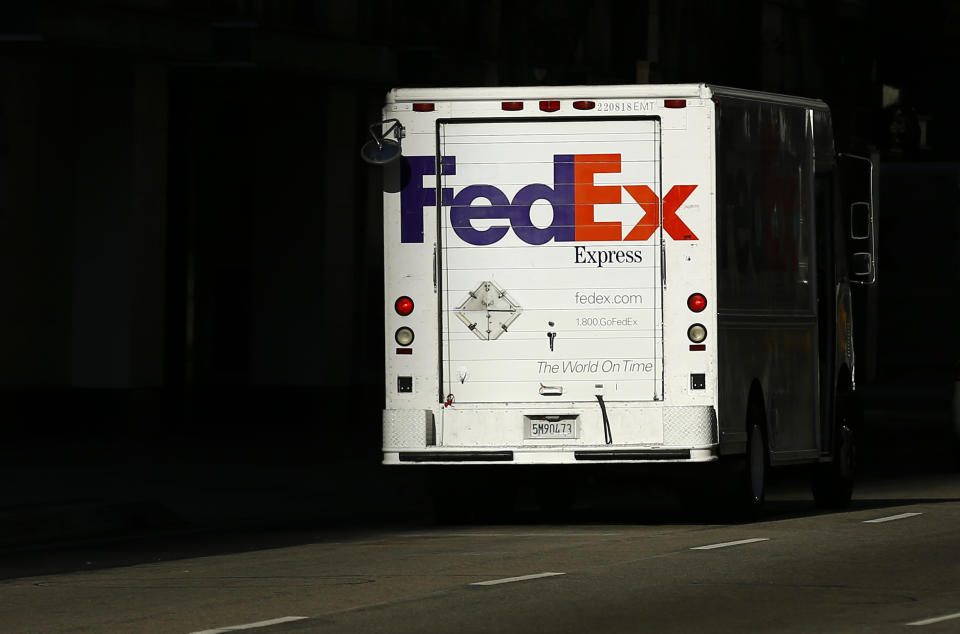 A Federal Express truck on delivery is pictured in downtown Los Angeles, California October 29, 2014. Determined not to repeat a holiday season that left millions of packages delivered too late and customers seething, United Parcel Service Inc and FedEx Corp are investing heavily in new infrastructure - but the continued dynamic growth of e-commerce will test those efforts. The world's two largest shipping companies are building new facilities, adding more temporary holiday workers and pushing retailers to help them avoid a recurrence of a pre-Christmas shipping logjam.    REUTERS/Mike Blake (UNITED STATES - Tags: BUSINESS)