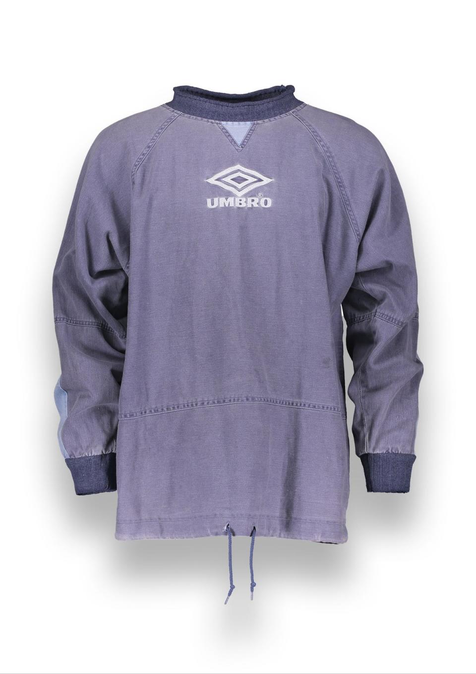 The Spring Summer 1996 drill top identical to the one worn by Liam Gallagher when Oasis played at Manchester City FC’s Maine Road stadium in April 1996 (UMBRO)