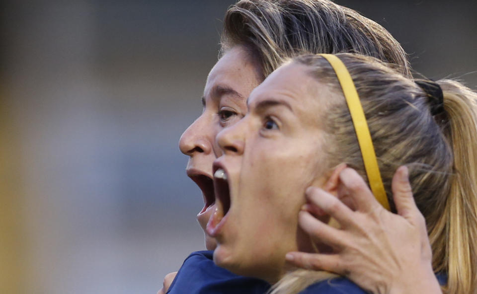 Boca Juniors' Yamila Rodriguez, left, celebrates scoring against Lanus with teammate Camila Ares, during the Superliga women's tournament in Buenos Aires, Argentina, Saturday, March 9, 2019. The women competed in one of Argentina's most famous stadiums on Saturday, a milestone for the female players who are fighting for the same rights as male soccer players in the country's most popular sport. (AP Photo/Natacha Pisarenko)