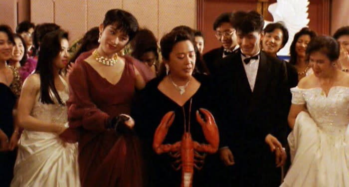 Deanie Ip as Aunt Eleven, wearing a 'lobster dress designed for her' in 'Dances with Dragon'