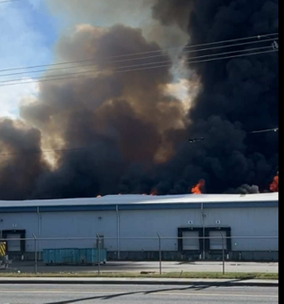 Flames were coming from the roof of Lineage Logistics in Finley east of Kennewick, Wash., Sunday afternoon.