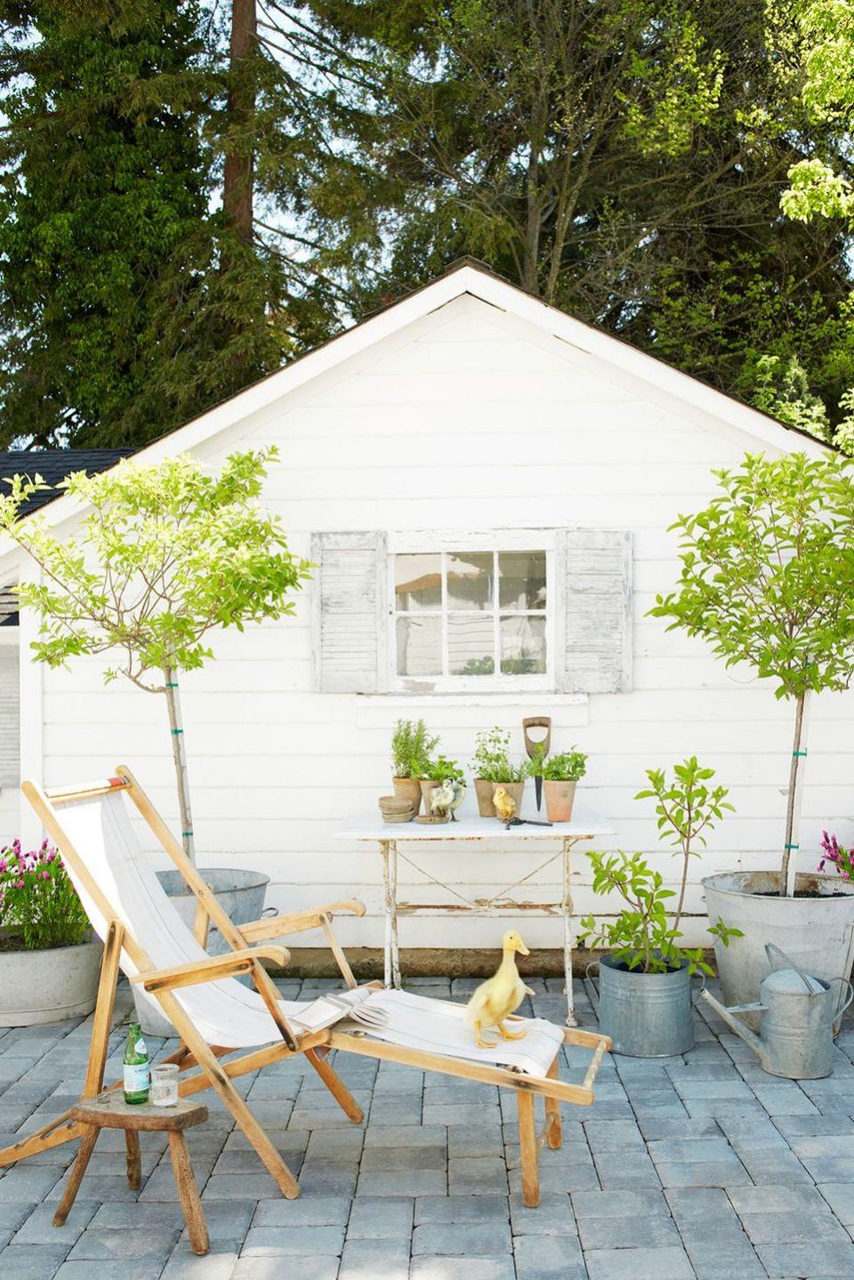 <p>Keep things light and bright by decorating your space with all-white furniture. Use the patio furniture as a base, accenting your space with loads of greenery. </p><p><strong>RELATED:</strong> <a href="https://www.goodhousekeeping.com/home-products/g27257593/best-outdoor-furniture/" rel="nofollow noopener" target="_blank" data-ylk="slk:The Best Outdoor Furniture You Can Buy;elm:context_link;itc:0;sec:content-canvas" class="link ">The Best Outdoor Furniture You Can Buy </a></p>