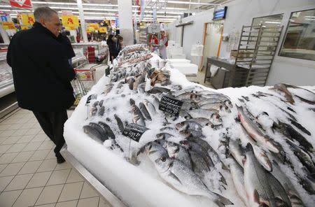 A customer visits the fish department of a hypermarket of French grocery retailer Auchan in Moscow, January 15, 2015. REUTERS/Maxim Zmeyev