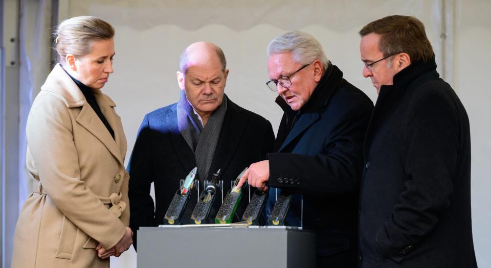 From left to right: Danish Prime Minister Mette Frederiksen, German Chancellor Olaf Scholz, Rheinmetall CEO Armin Papperger, and German Minister of Defense Boris Pistorius look at 35mm anti-aircraft ammunition during the inauguration of a new Rheinmetall ammunition factory, in February 2024. <em>Photo by Philipp Schulze/picture alliance via Getty Images</em>