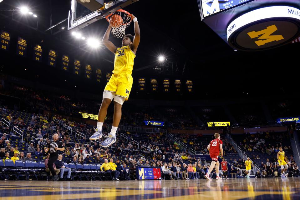 Feb 7, 2024; Ann Arbor, Michigan, USA; Michigan Wolverines forward Tarris Reed Jr. (32) dunks in the first half against the Wisconsin Badgers at Crisler Center. Mandatory Credit: Rick Osentoski-USA TODAY Sports