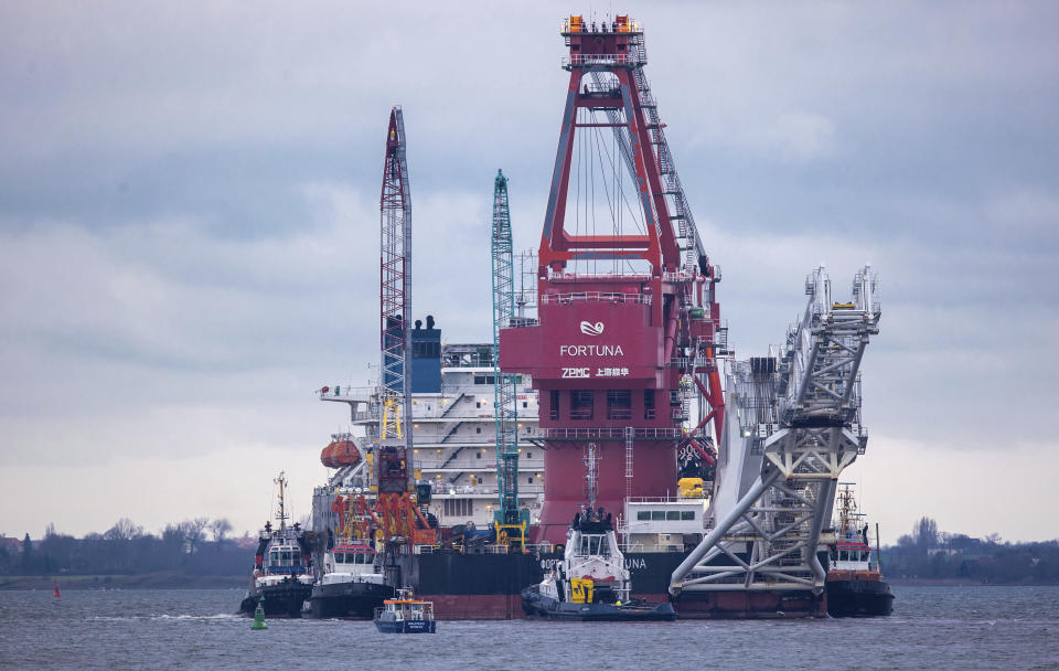 Tugboats get into position on the Russian pipe-laying vessel "Fortuna" in the port of Wismar, Germany, Thursday, Jan 14, 2021. The special vessel is being used for construction work on the German-Russian Nord Stream 2 gas pipeline in the Baltic Sea. ( Jens Buettner/dpa via AP)