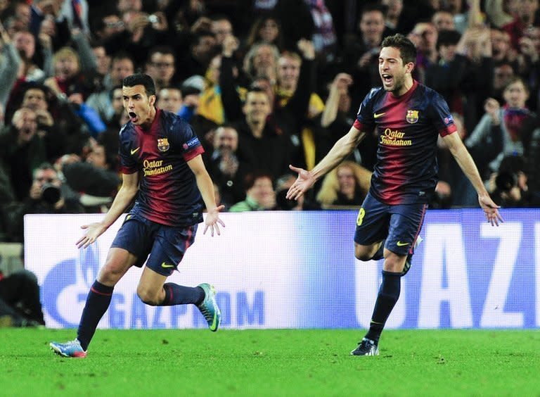 Barcelona's Pedro Rodriguez (L) celebrates with Jordi Alba after scoring during their Champions League match against PSG on April 10, 2013. The 71st-minute strike by Pedro allowed Barcelona to qualify for the semi-finals at the expense of PSG