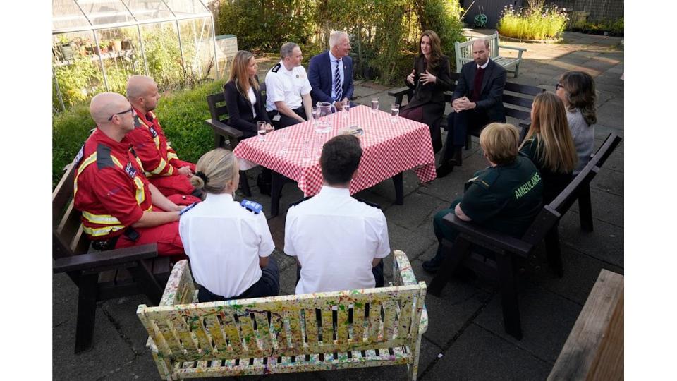 Prince William, Prince of Wales and Britain's Catherine, Princess of Wales speak to members of the emergency services during a visit to Southport Community Centre 