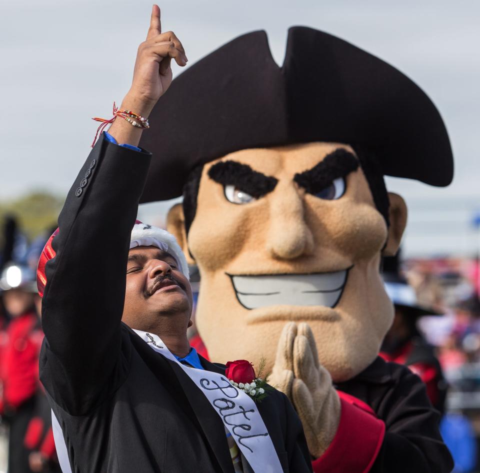 Jayrin Patel reacts after being crowned William Penn homecoming king by the Colonial mascot.