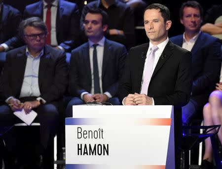 Benoit Hamon of the French Socialist party attends a prime-time televised debate for the candidates at French 2017 presidential election in La Plaine Saint-Denis, near Paris, France, April 4, 2017. REUTERS/Lionel Bonaventure/Pool