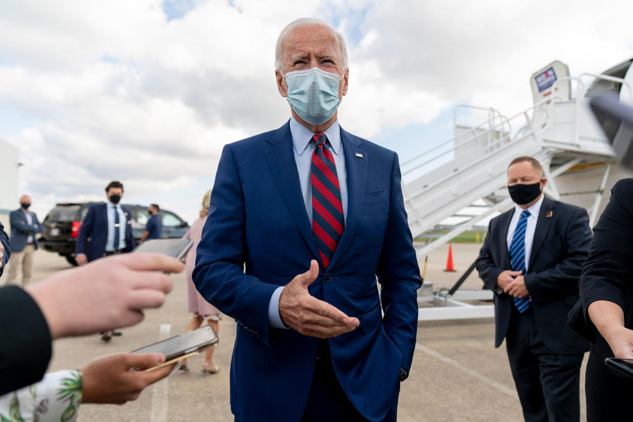 Democratic presidential candidate former Vice President Joe Biden speaks to member of the media before boarding his campaign plane at New Castle Airport in New Castle,