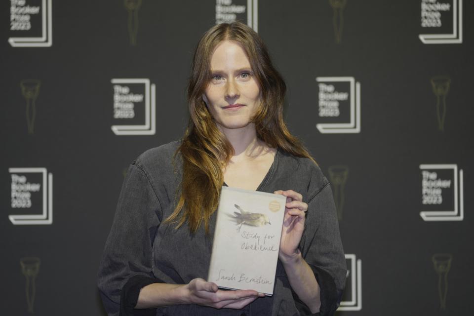 Canadian author Sarah Bernstein poses with her book "Study for Obedience" during a photocall with the six shortlisted authors for the Booker Prize 2023, in London, Thursday, Nov. 23, 2023 ahead of the award ceremony on Nov. 26 in London. (AP Photo/Kin Cheung)