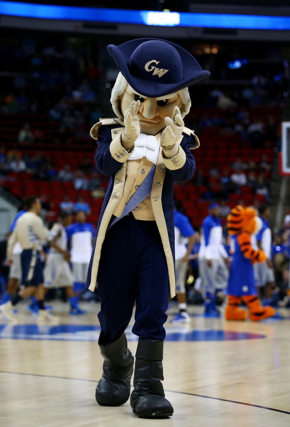 RALEIGH, NC - MARCH 21:  George Washington Colonials mascot, George, performs in the first half against the Memphis Tigers during the Second Round of the 2014 NCAA Basketball Tournament at PNC Arena on March 21, 2014 in Raleigh, North Carolina.  (Photo by Streeter Lecka/Getty Images)